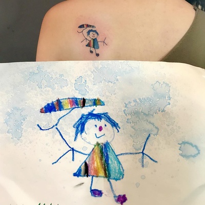 第一次纹身的经历的图片-我把我女兒送我的一幅畫紋上了<br>因為她跟我說，下雨天不僅想給我送雨傘，還希望我能看到彩虹